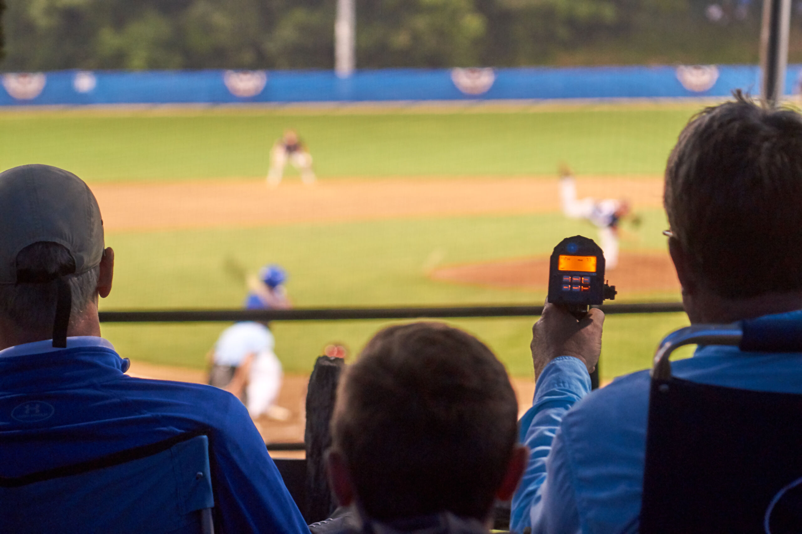 Talent,Scouts,With,Radar,Guns,During,A,Baseball,Game,In