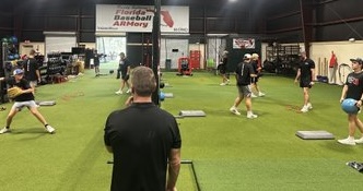 Randy observing throwing drills